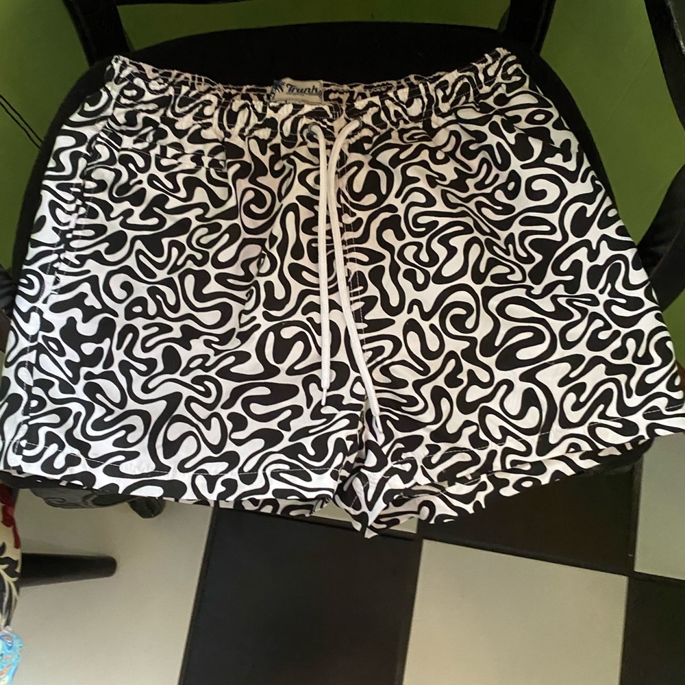 Black and white ‘Trunks’ brand swim shorts